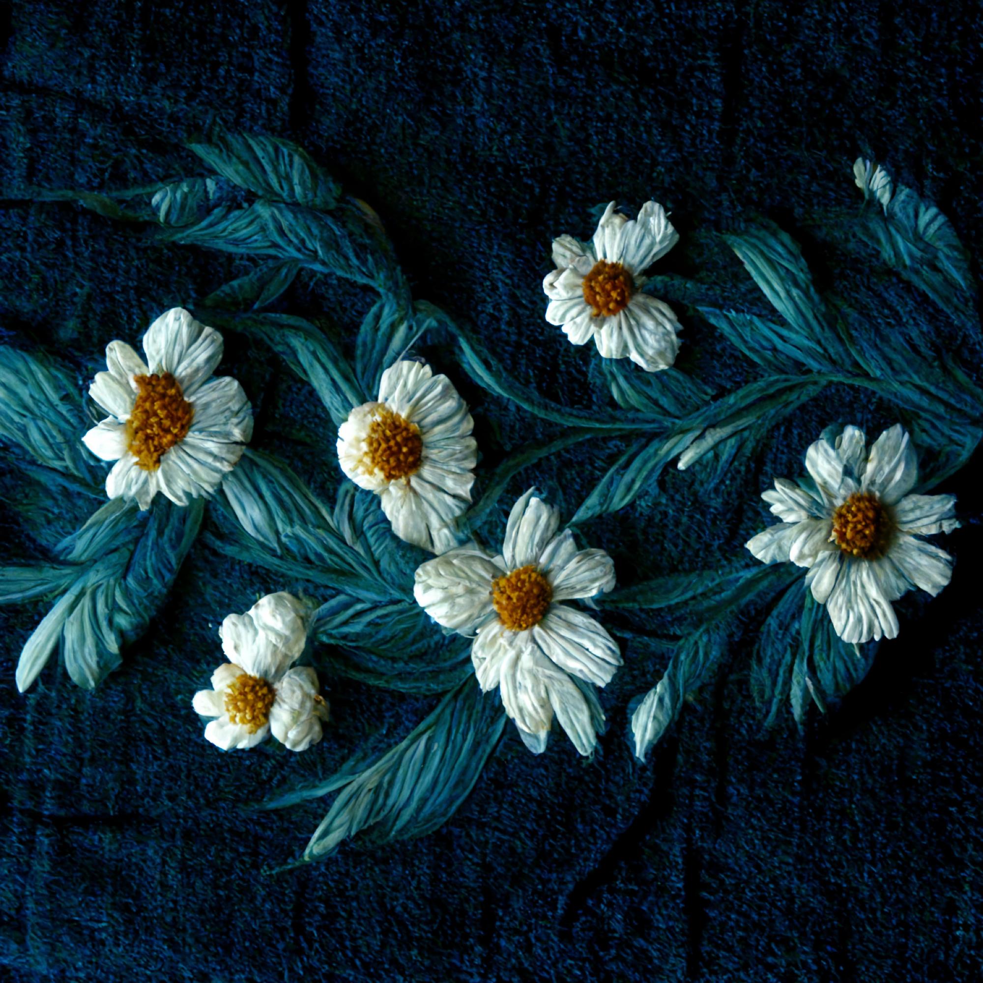 Embroidered floral patch on denim with metallic threads